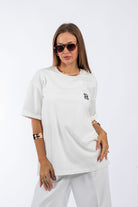 Christina's Storm-Cream Emblem T-shirt-T-Shirts-1-roqelvaxirum.shop